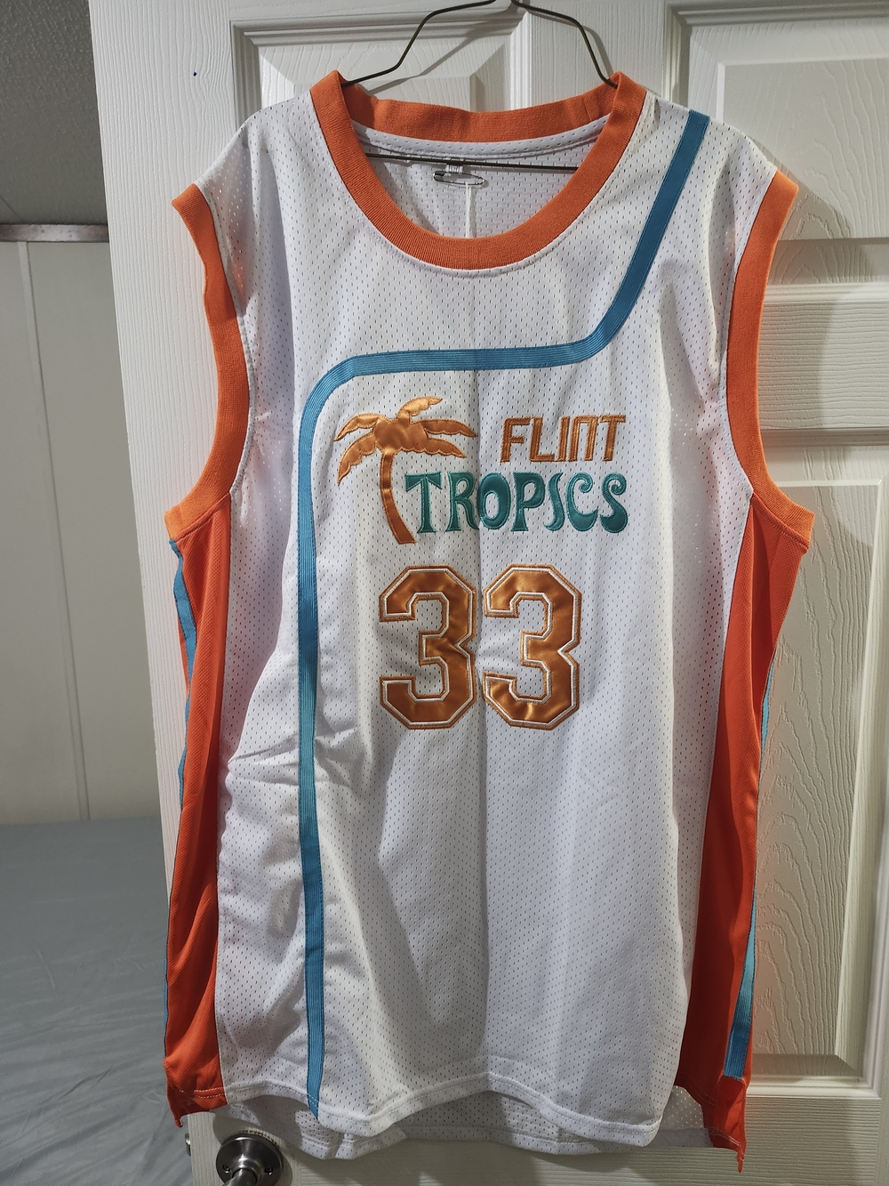 Flint Tropics Men's White & Orange Basketball Jersey - #33-Jackie Moon